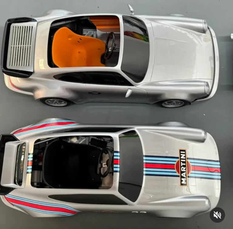 Two silver 911 replicas seen from above