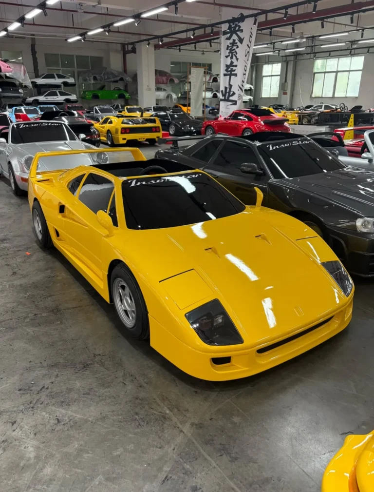 Yellow F40 replica among the workshop stock